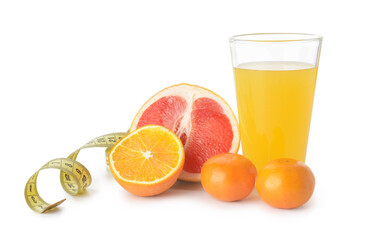 Glass of juice, citrus fruits and measuring tape on white background