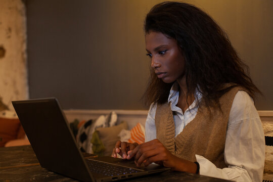 confident black business woman working on computer