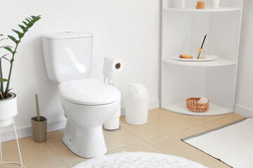 Interior of stylish modern restroom with toilet bowl