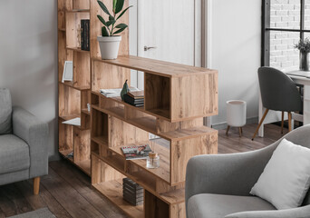 Wooden bookcase in interior of modern living room