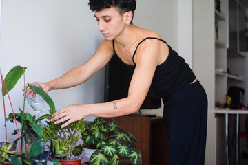 Latinx non binary person gardening at home