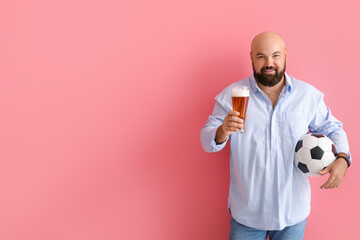 Bald man with beer and soccer ball on color background
