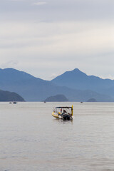 Obraz premium fisherman boat with islands in the background