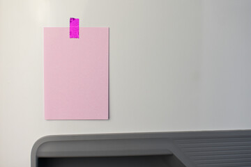 Pink note reminder paper sticked in freezer, fridge with glitter pink sticker. Refrigerator message