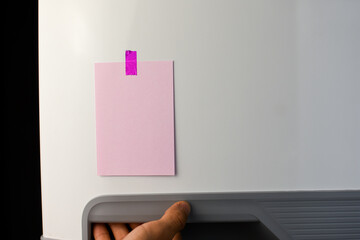 Pink note reminder paper sticked in freezer, fridge with glitter pink sticker. Refrigerator message