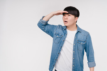 Young handsome asian korean man looking far away isolated in white background. Sale offer discount...