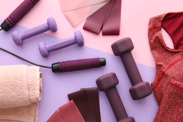 Set of sports equipment and clothes on color background, closeup