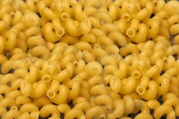 Dry pasta. Macaroni pasta. Diet and food concept.