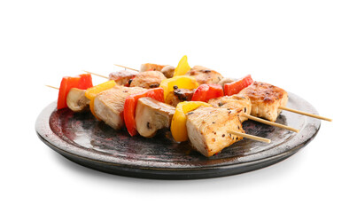 Plate of grilled chicken skewers with vegetables isolated on white background