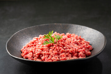 Raw ground beef ready for preparation.