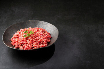 Raw ground beef ready for preparation.