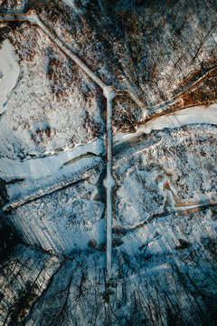 An aerial top-down view of a bridge over a 