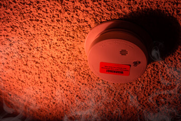Security, burning house. Fire threat. Smoke detector and interconnected fire alarm.Smoke.with space...