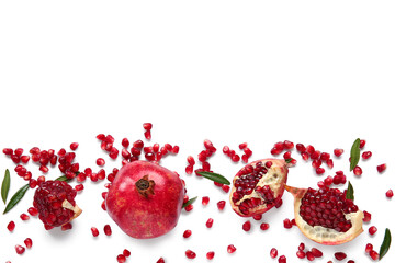 Tasty ripe pomegranate with seeds on white background