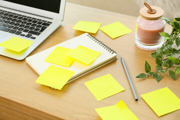 Notebook with blank sticky notes and pencil on table, closeup