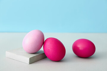 Painted eggs for Easter celebration on color background