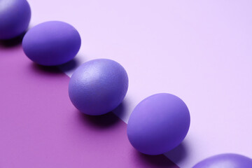 Painted eggs for Easter celebration on color background