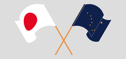 Crossed and waving flags of Japan and the State of Alaska