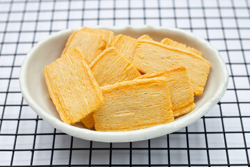 Cheese crispies on metal cooling rack