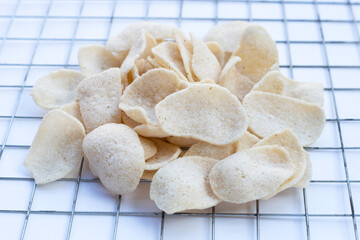Prawn crackers on white background. Shrimp crispy rice snack