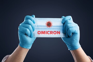 Doctor holds a face mask. Omicron variant of coronavirus