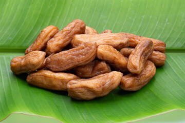 Sun-dried bananas on banana leaf