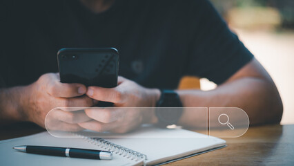 Search technology, search engine optimization,man's hand using laptop computer keyboard to search information,using search engine bar function on your website.People who work in cafes