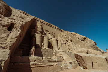 Aswan landmarks. Abu Simbel temple in Aswan. Traveling girl. Ramses the second temple. Nefertari...