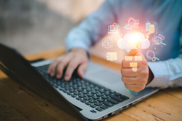 Closeup image of a business man's hands working and typing on laptop computer keyboard on office table.Business intelligence.