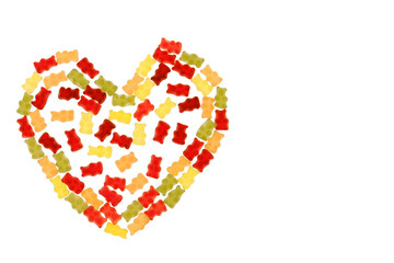 Jelly bears candy isolated on a white background.Gummy bear heart.candy heart.Jelly lowcalorie sweet. Children's dessert.Jelly multicolored bears assorted.Sweet pattern in yellow and red colors.