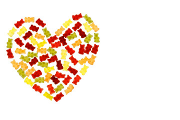 Jelly bears candy isolated on a white background.Gummy bear heart.candy heart. Children's dessert.Jelly multicolored bears assorted.Sweet pattern in yellow and red colors.