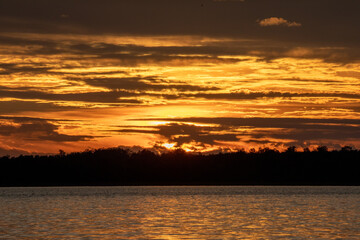 Fototapeta premium Beautiful sunsets at the lake cabin in Northern Minnesota remind us of the beauty in nature when we travel and explore vacation resorts and remote wilderness areas