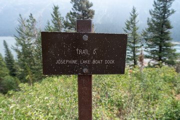 Sign leading hikers to Josephine Lake Boat Dock, along the Grinnell Glacier Hiking trail in Glacier National Park
