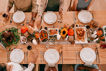 Gather around the table, its time to give thanks. High angle shot of a group of friends having a...