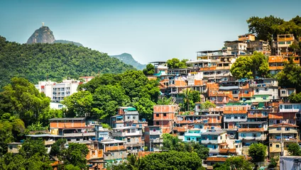 Papier Peint photo Brésil Christ looking at Favela (Shanty Town) in Rio De Janeiro, Brazil