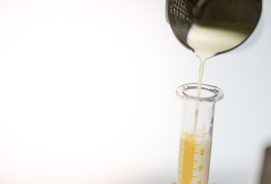 The Female Hand Holding And Pouring A Nutrient Food To Tube , Liquid Feed To Patients Who Can Not Eat Foods By Mouth.