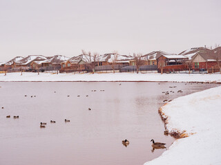 Overcast view of snowy residence house
