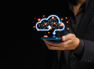 Businessman in a suit holding a mobile phone login to the cloud system for transfer data