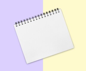 White Notepad on multicolored background.