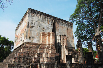 Ancient architecture and ruins building of Wat Si Chum temple and Pra Ajana buddha statues for thai people travel visit in Si Satchanalai Historical Park in World Heritage Site at Sukhothai, Thailand