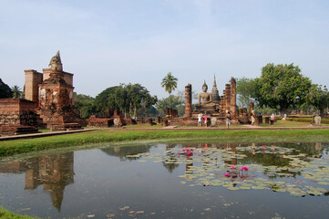Fototapeta na wymiar Ancient antiquity architecture and antique ruins building for thai people travelers travel visit respect praying at Si Satchanalai Historical Park and Unesco World Heritage Site in Sukhothai, Thailand