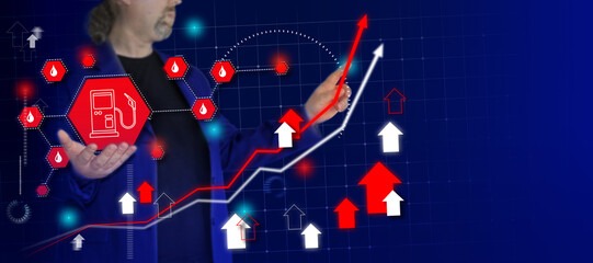 Businessman draw growth graph and hold petrol pump sign - fuel prices rising. Business planning and strategy. Rise of oil and gas on stock markets. Background with place for text.