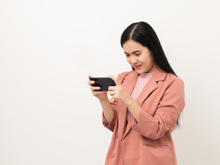 Cheerful young Asian woman using smartphone and checking message on mobile chat application isolated white background. Fashion style asian lovely woman playing game or shopping online by cellphone