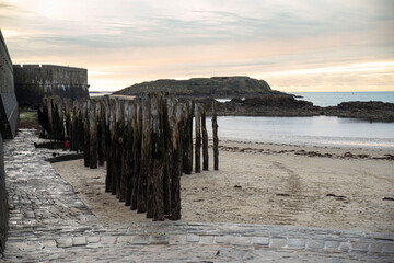 Breakwater and ramparts of Saint Malo on the beach in Brittany