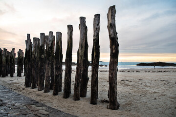 Breakwater of Saint Malo on the beach in Brittany to protect the city from the waves
