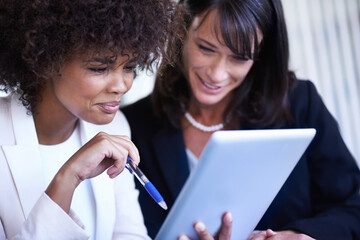 Powerful women in the workplace. Cropped shot of two businesswoman working together.