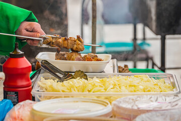 cooking and selling barbecue on the street in the field, hot meat food