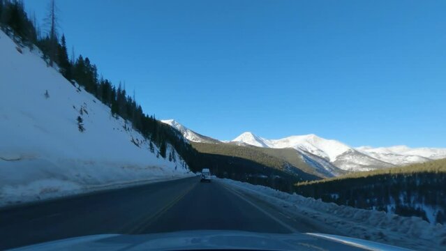 Driving over the Continental Divide while the sunsets on Monarch Pass in Colorado during the winter