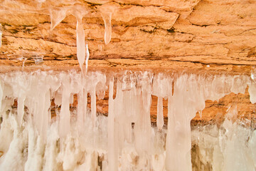 Rock cavern detail in winter covered in ice formations