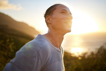 Its such a beautiful morning. Shot of a young taking a breather during his outdoor training.
